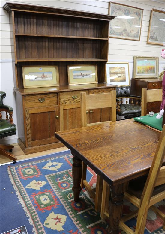 An oak dining suite, comprising dresser, dining table and a set of six chairs